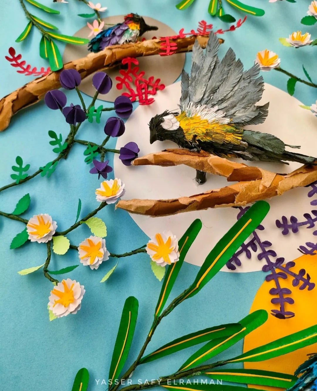 Colorful artwork by Yasser Safy Elrahman depicting birds in a garden scene, showcasing vibrant feathers and lush greenery.