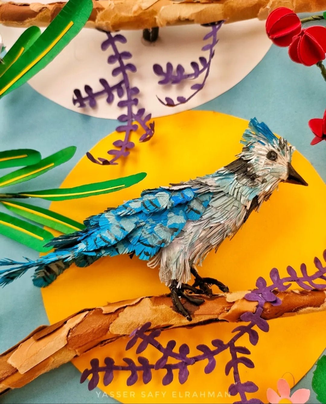 Colorful garden bird artwork by Yasser Safy Elrahman featuring various birds perched among garden foliage.