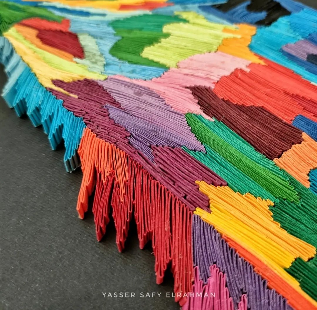 Colorful giraffe artwork by Yasser Safy Elrahman, showcasing vibrant hues and graceful design in a striking artistic piece.