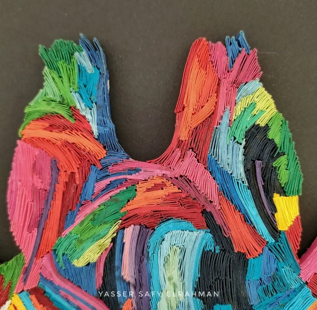 Colorful giraffe artwork by Yasser Safy Elrahman, showcasing a vibrant, abstract giraffe with a spectrum of bright colors.