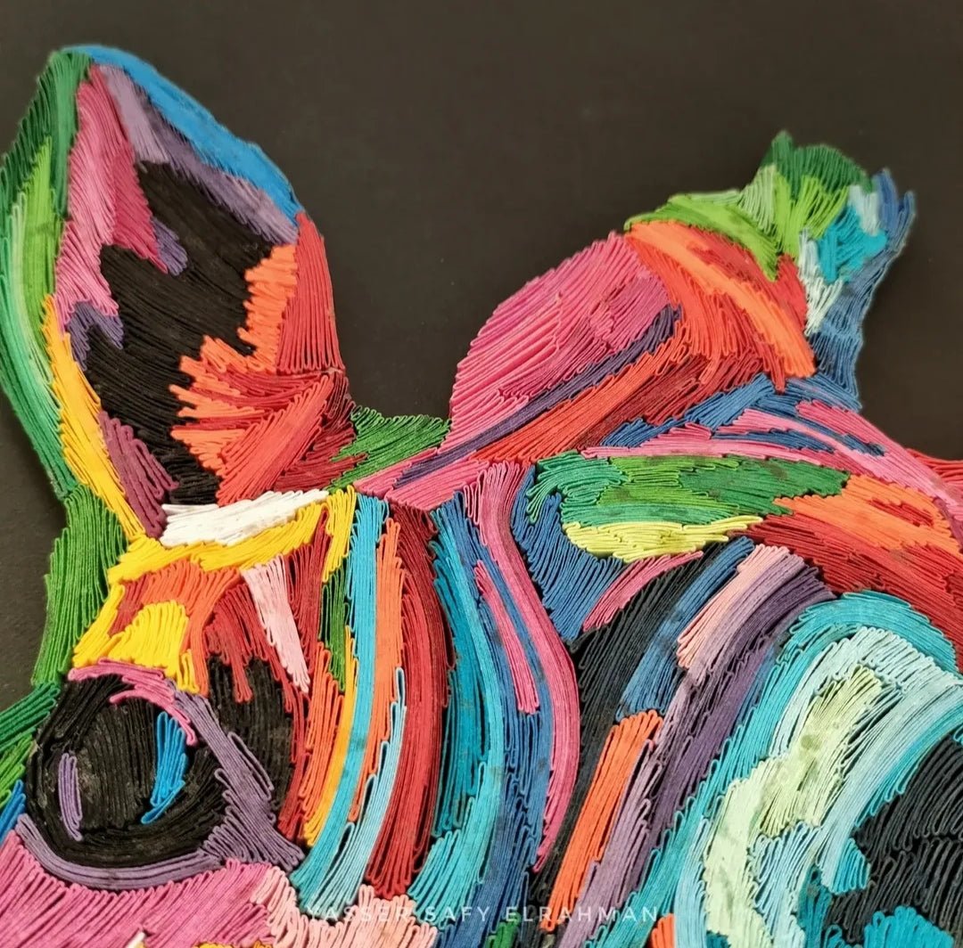 Colorful giraffe artwork by Yasser Safy Elrahman showcasing vibrant, abstract animal art with a spectrum of bright colors.