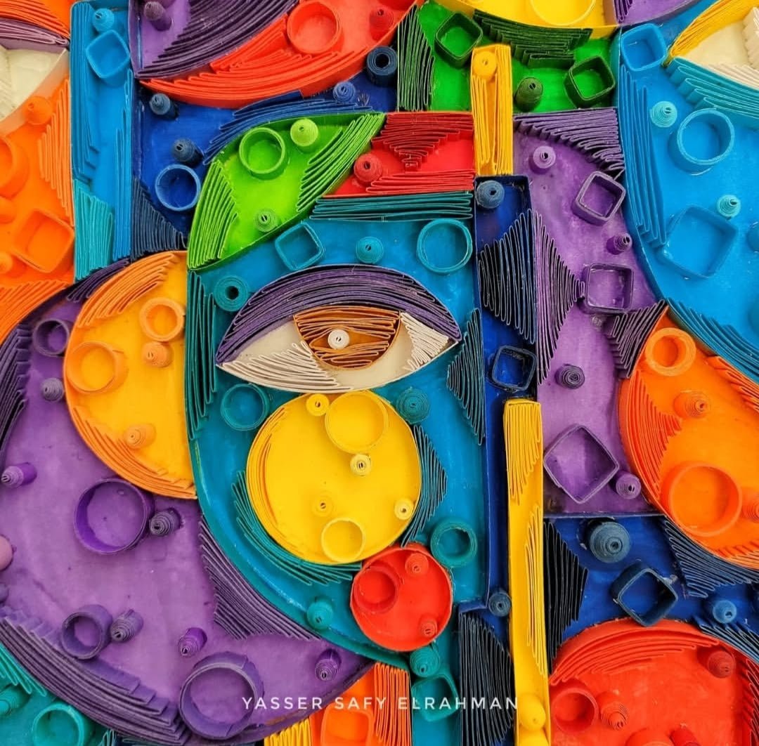 Abstract artwork titled Cubiest Faces by Yasser Safy Elrahman featuring vibrant geometric face designs.