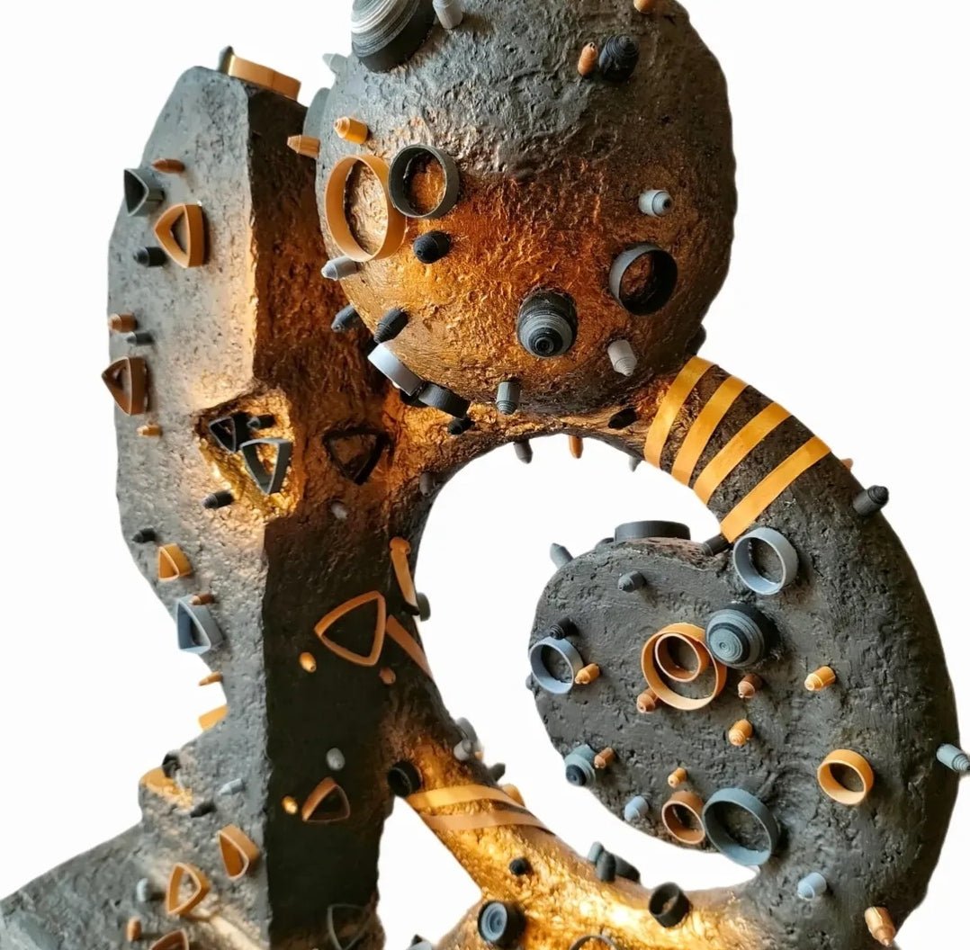 Darkening of the Light sculpture by Yasser Safy Elrahman, featuring abstract shapes and dark-toned surfaces in a modern art style.