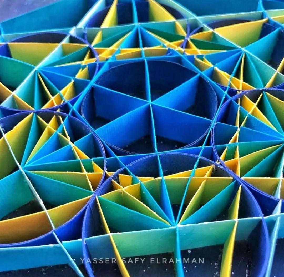 Sacred geometry artwork titled "Echoes of Order" by Yasser Safy Elrahman, featuring intricate geometric patterns and vibrant colors.