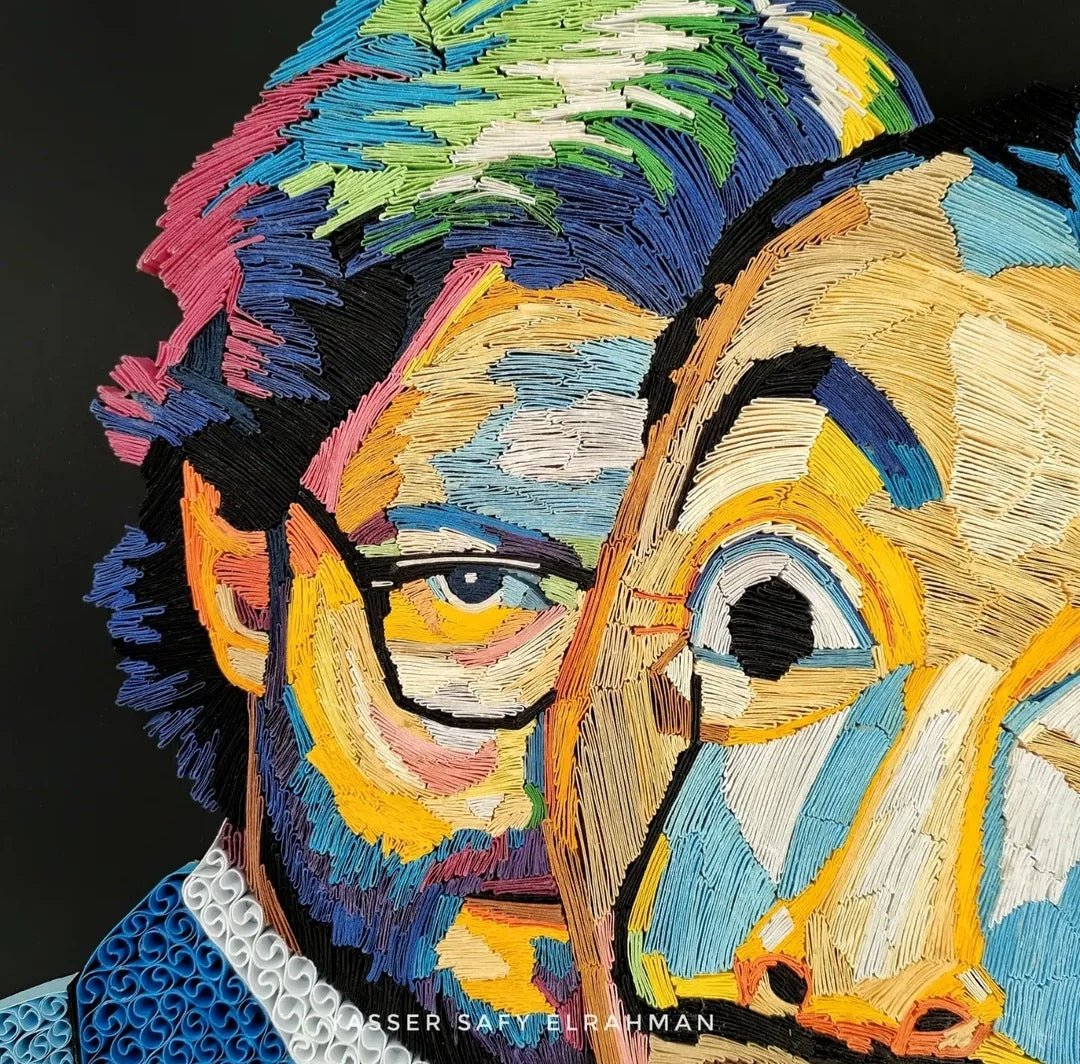 Colorful portrait artwork titled "El Profesor: A Mastermind" by Yasser Safy Elrahman, featuring vibrant, detailed artistic design.