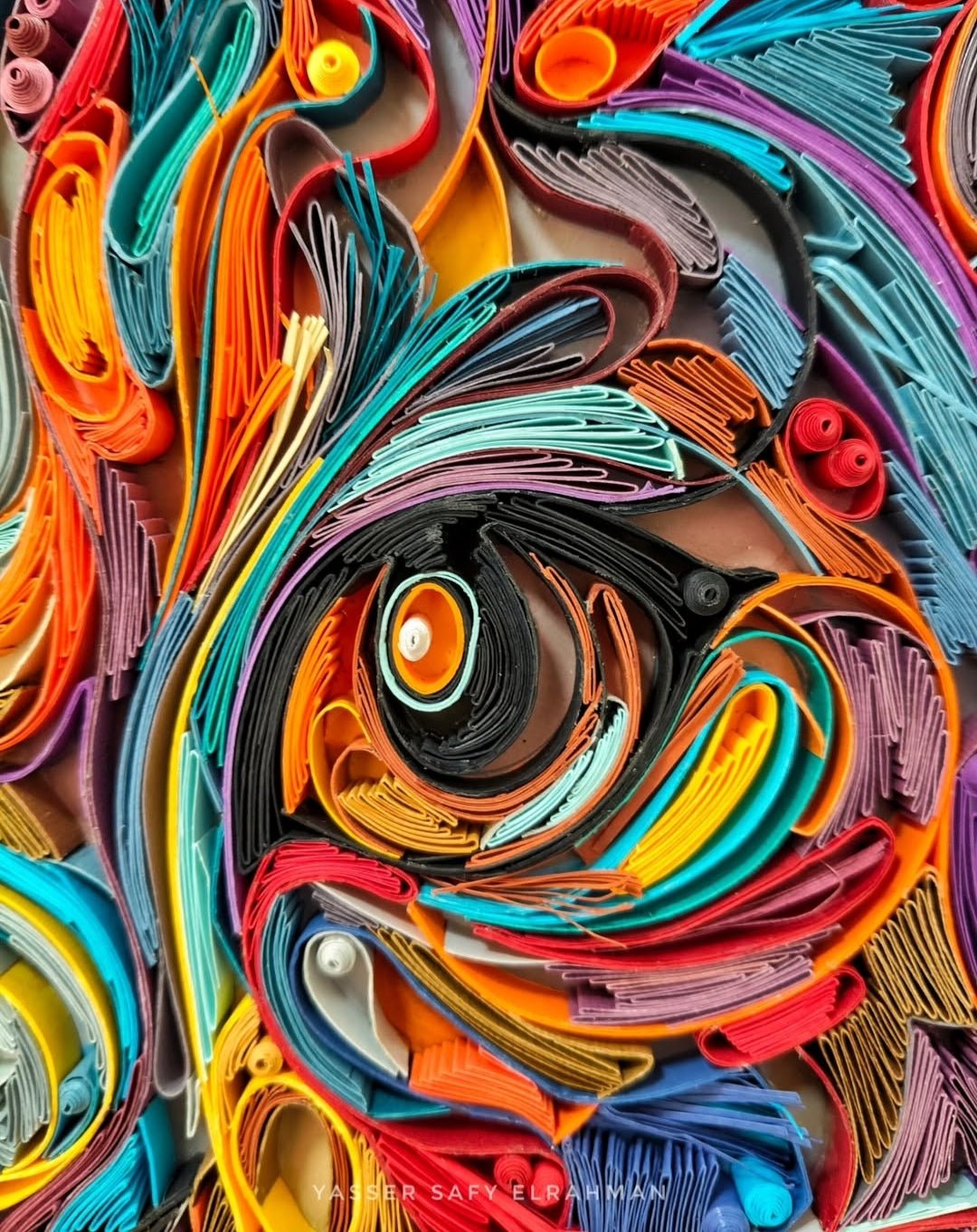 Colorful cat portrait artwork titled James in Colors by Yasser Safy Elrahman, featuring vibrant, abstract feline art.