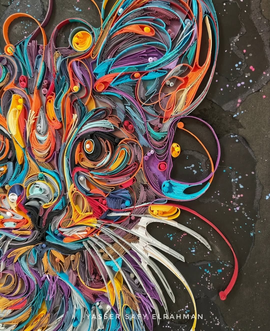 Colorful cat portrait artwork titled "James in Colors" by Yasser Safy Elrahman featuring vibrant, abstract feline art.