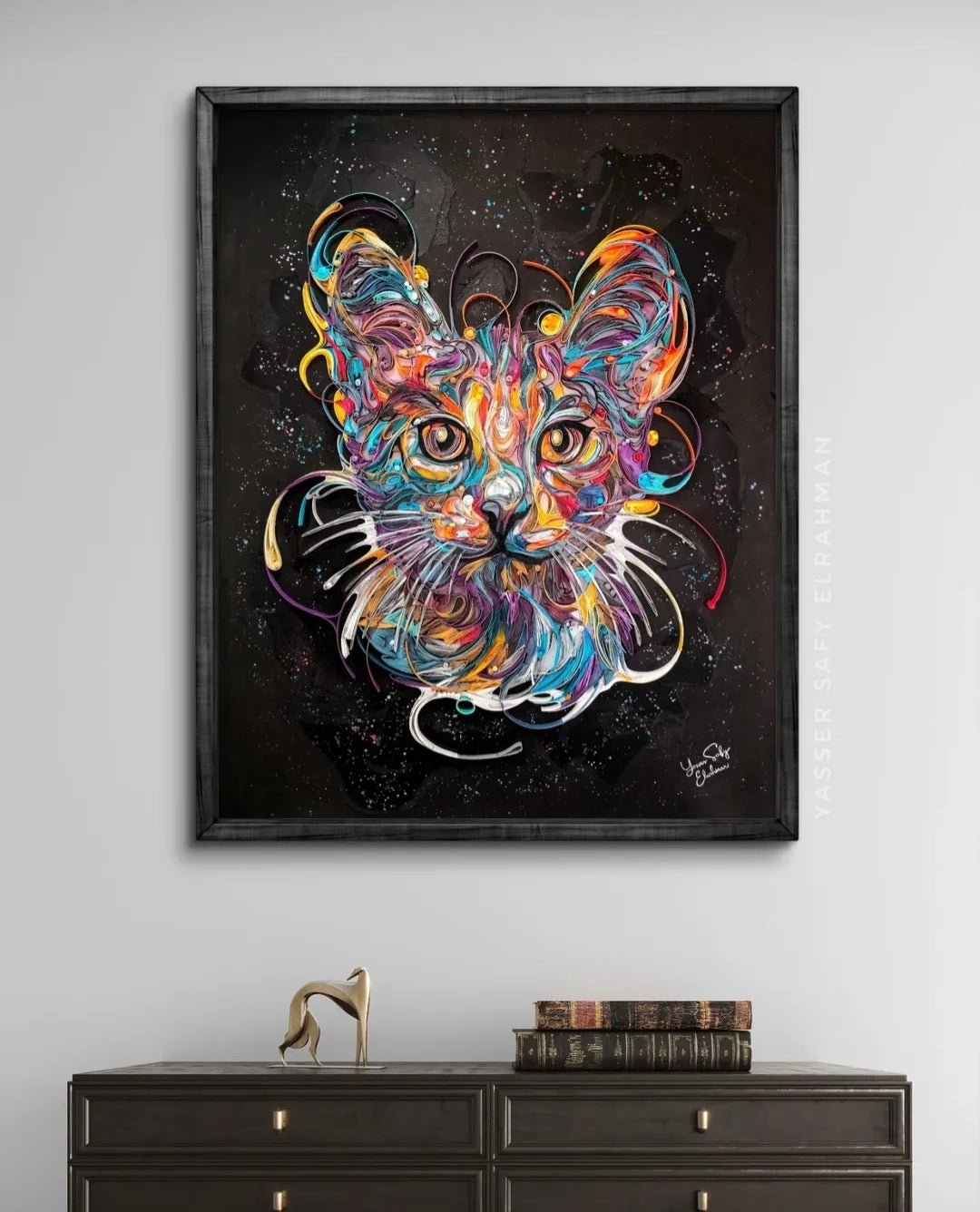 Colorful cat portrait artwork titled James in Colors by Yasser Safy Elrahman, featuring vibrant, artistic feline imagery.