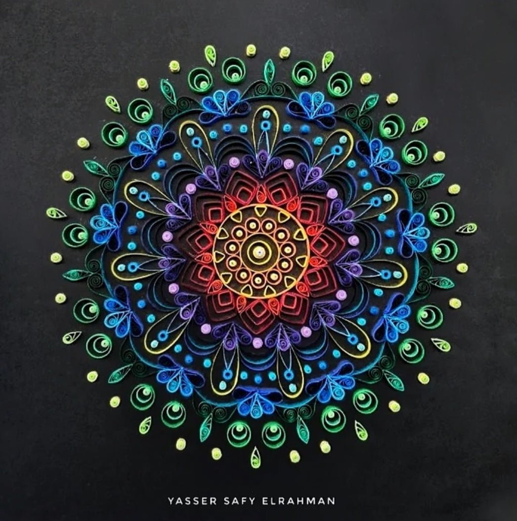 Colorful mandala artwork titled "Kaleidoscope of Peace" by Yasser Safy Elrahman, featuring intricate, vibrant geometric patterns.