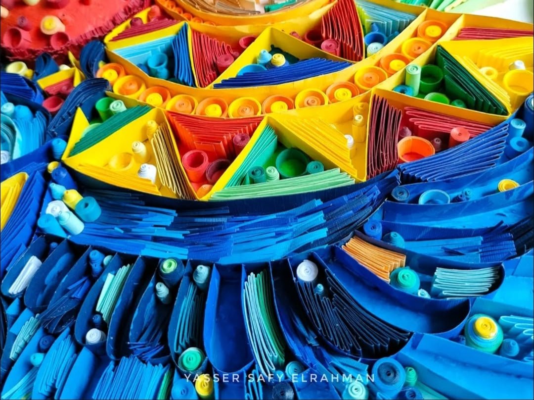 Ancient Egyptian Sacred Life paper quilling artwork by Yasser Safy Elrahman showcasing intricate designs and vibrant colors.