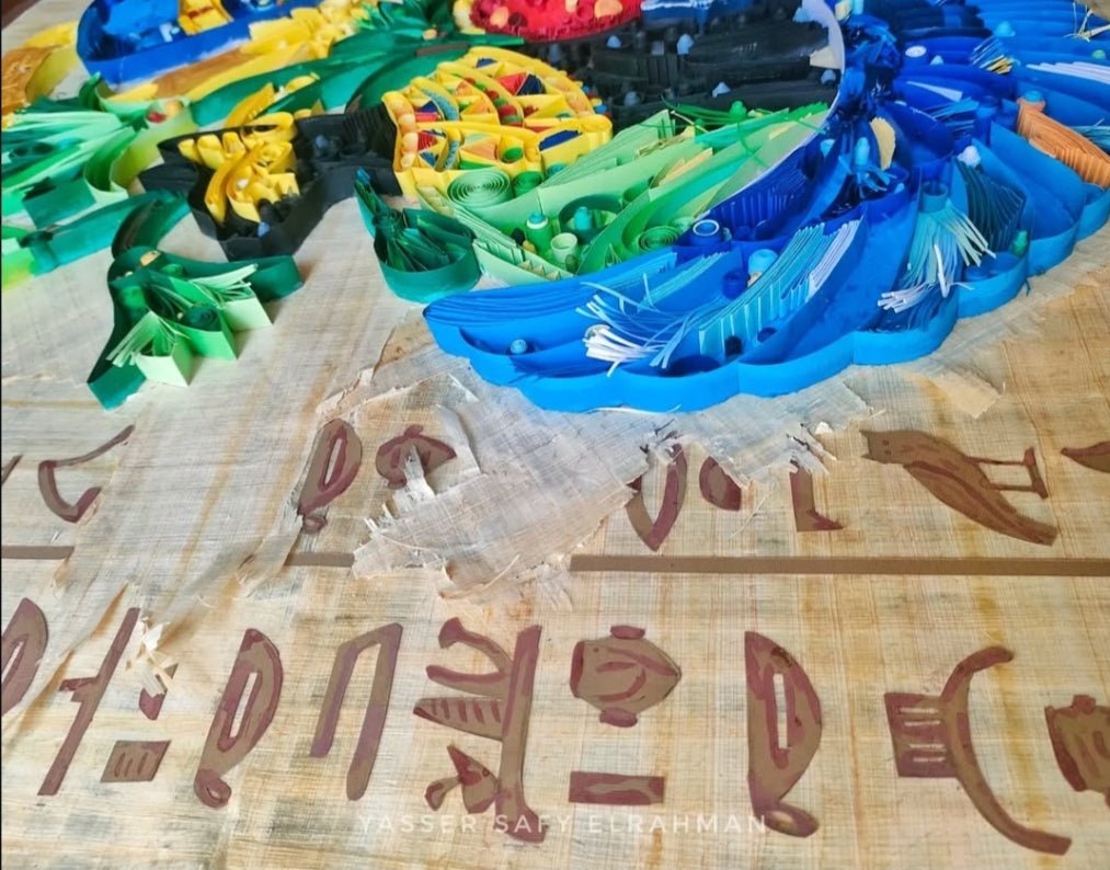 Ancient Egyptian paper quilling artwork titled Nah Nitry Sacred Life by Yasser Safy Elrahman, featuring intricate designs and vibrant colors.