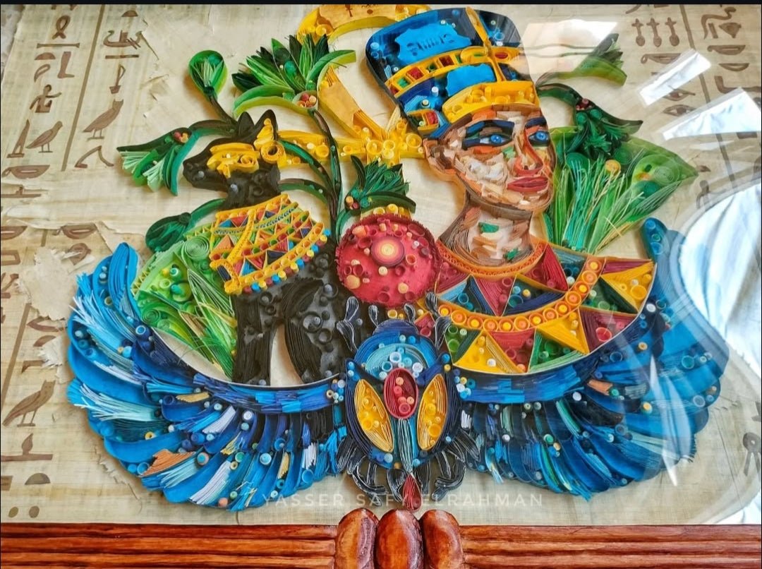 Ancient Egyptian paper quilling artwork titled Nah Nitry Sacred Life by Yasser Safy Elrahman featuring intricate designs and vibrant colors.