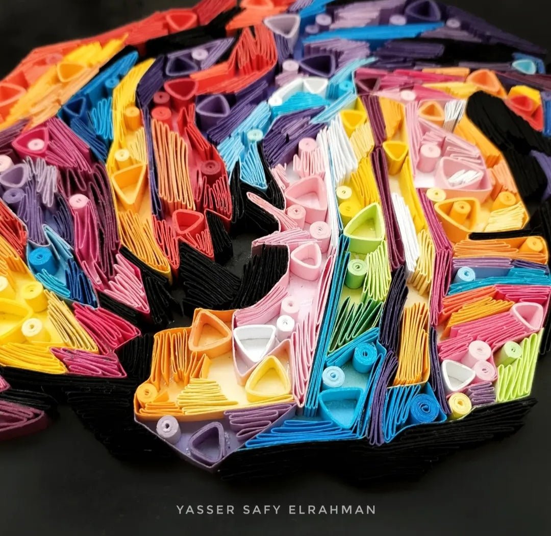 Colorful paper quilling artwork of The Joker titled Chaos in Colors by Yasser Safy Elrahman.
