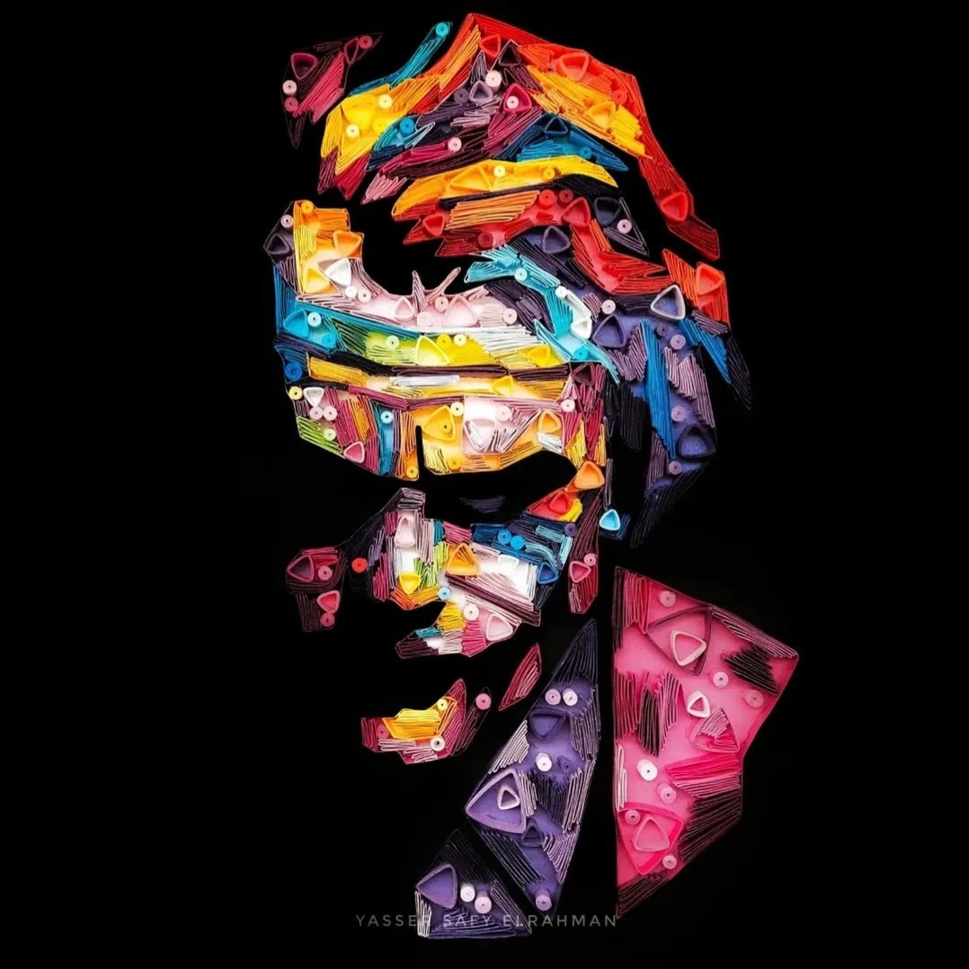 Colorful paper quilling artwork of The Joker titled Chaos in Colors by Yasser Safy Elrahman.