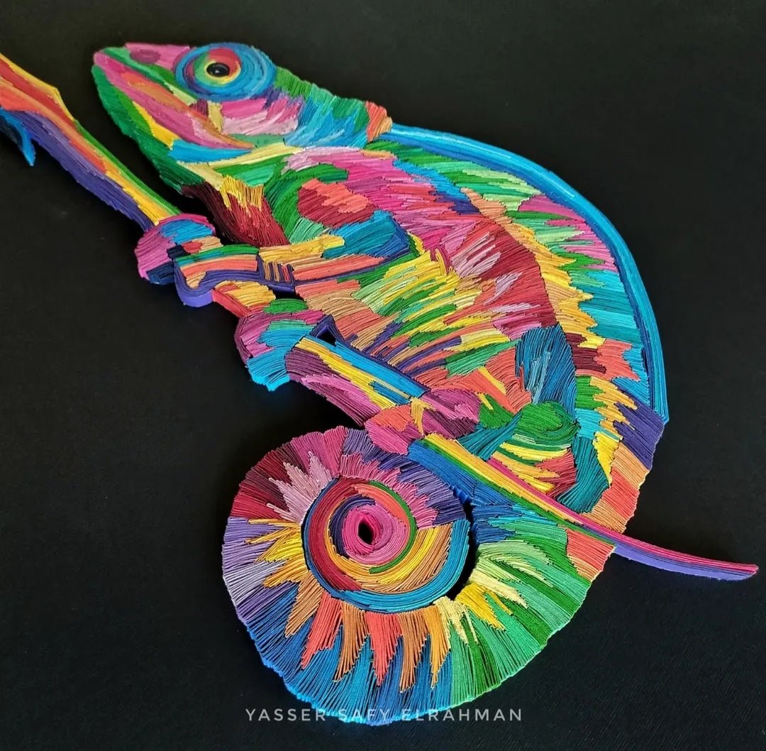 Vibrant chameleon mosaic paper quilling artwork by Yasser Safy Elrahman, showcasing colorful, intricate paper coils forming a joyful chameleon figure.