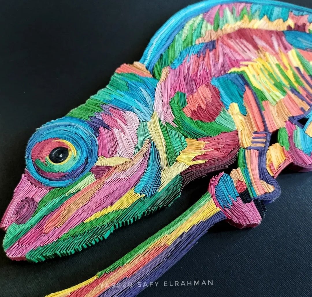 Vibrant chameleon mosaic paper quilling artwork by Yasser Safy Elrahman, featuring colorful, intricate paper coils forming a lively chameleon.