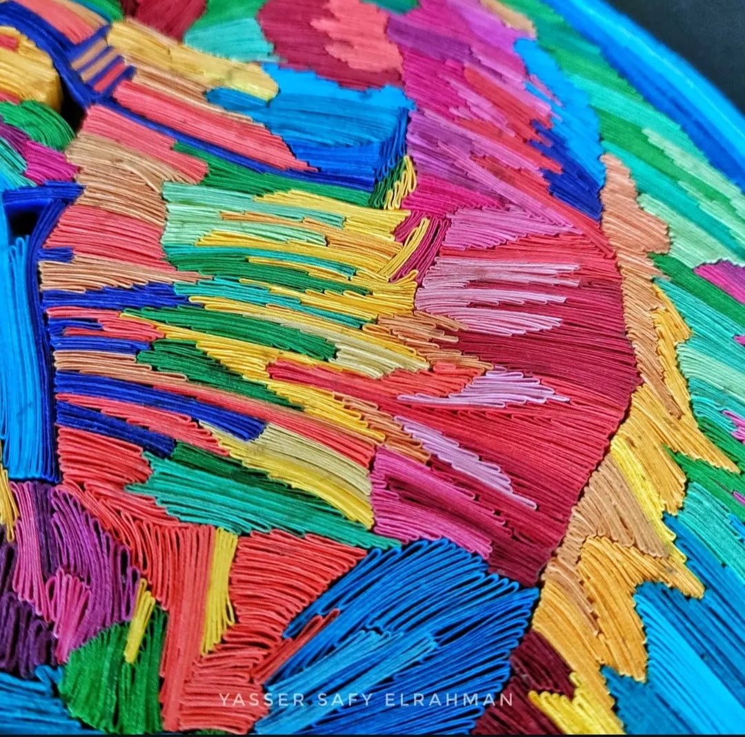 Colorful chameleon mosaic paper quilling artwork by Yasser Safy Elrahman featuring intricate, vibrant paper coils and detailed design.