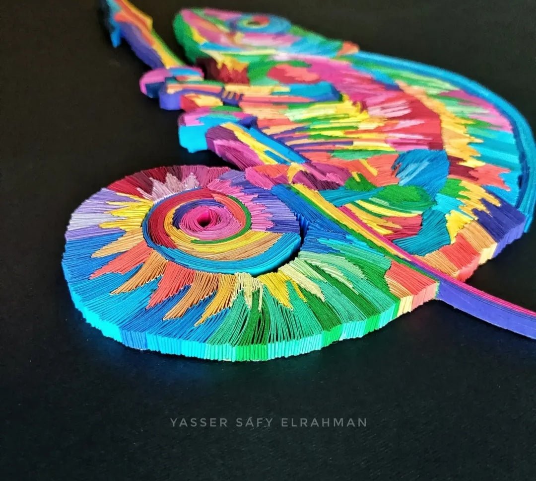 Vibrant chameleon mosaic paper quilling artwork by Yasser Safy Elrahman, featuring colorful, intricate paper coil designs.