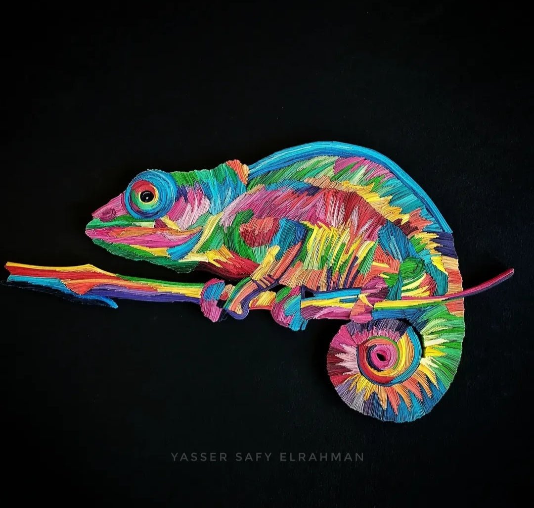 Vibrant chameleon mosaic paper quilling artwork by Yasser Safy Elrahman, featuring colorful, detailed paper coils forming a lively chameleon image.