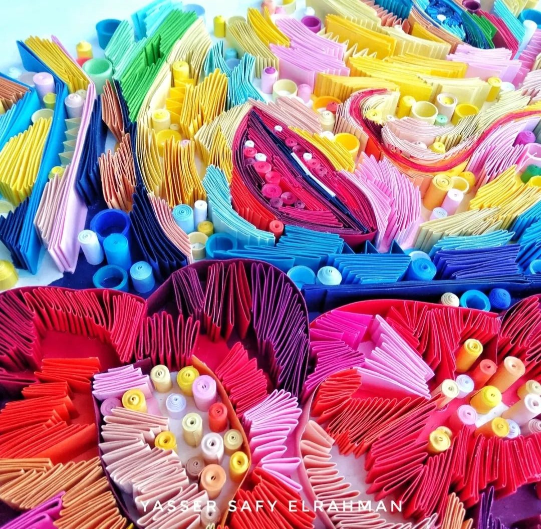 Colorful artwork by Yasser Safy Elrahman titled "The Woman in Colors: A Spectrum of Soul" depicting a vibrant, expressive female figure.