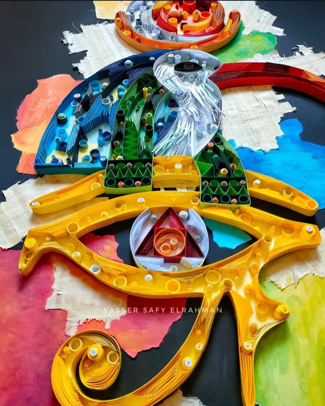 Artwork titled "Trismegistus: The Alchemy of Awareness" by Yasser Safy Elrahman featuring mystical alchemical symbols and abstract imagery.