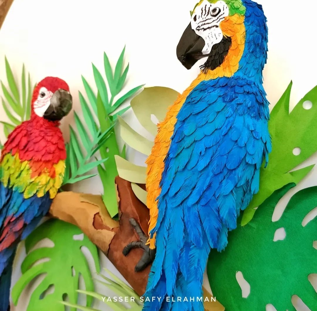 Colorful artwork of tropical parrots by Yasser Safy Elrahman, showcasing vibrant birds in a lush tropical setting.