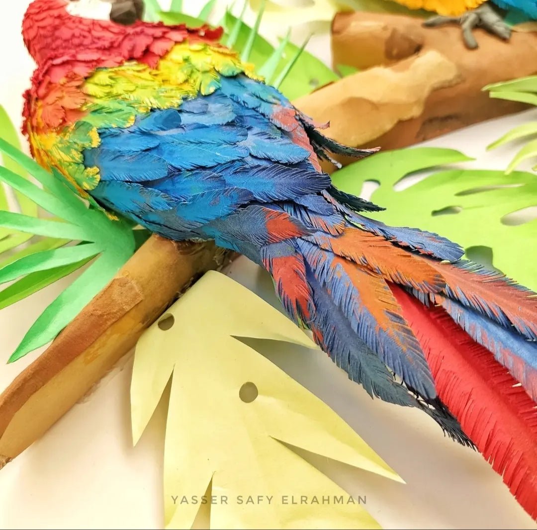 Colorful tropical parrots artwork by Yasser Safy Elrahman, showcasing vibrant bird portraits in a tropical setting.
