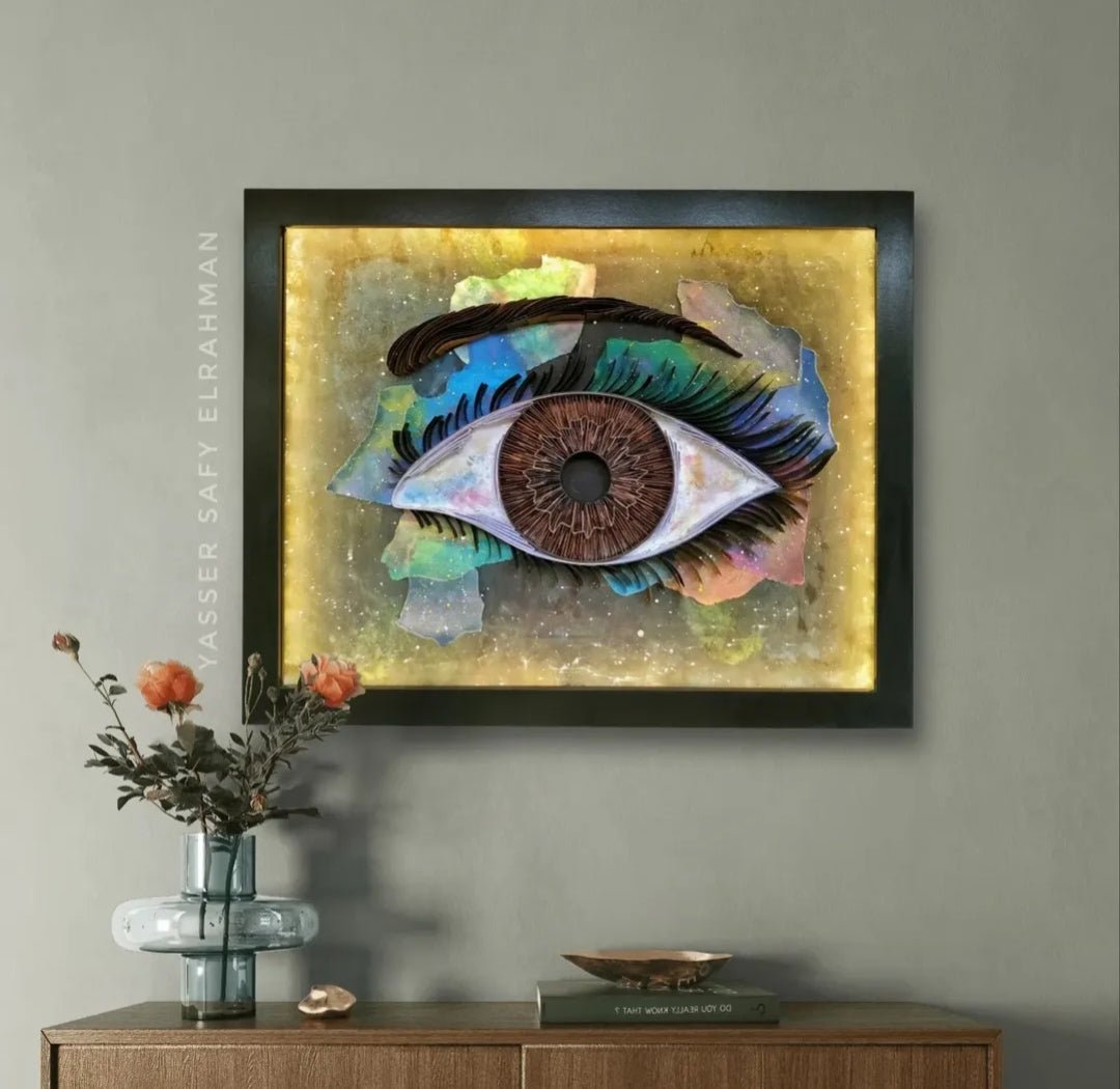 Colorful artwork titled Universe's Eye: The Witness of Magnificence by Yasser Safy Elrahman, featuring vibrant cosmic imagery.